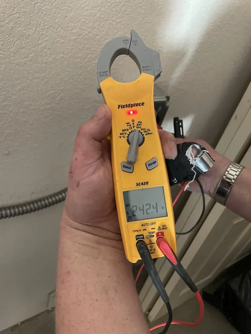 Voltage testing with clamp meter during Outlet Installation in Hayfork